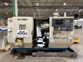 2002 OKUMA IMPACT LU-15 TWIN TURRET CNC LATHE USED