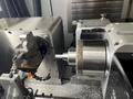 Tornos Almac CU 2007 7-Axis CNC Vertical Machining Center with Part Loading and Parts Catcher System, Probing, 20K Spindle, Lehman 2-Axis Rotary Table, Back Operation Tilting Rotary Vise