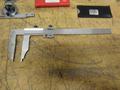 Etalon 14" Vernier Caliper, (2) Mitutoyo Protractors, Fowler 1" Travel Indicator, Mag Base Indicator Holder, SPI Radius and Surface Finish Gages- Auction Item