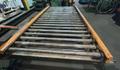 72" X 136"  PROGRESSIVE POWERED ROLLER STACKER CONVEYOR WITH 72" X 156" POWERED ROLLER RUN OUT CONVEYOR STOCK# 3896