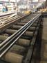 25" X 36" W.F. WELLS INC B-25-2 HORIZONTAL BAND SAW WITH 80' POWERED ENTERY CONVEYOR AND 32' POWERED EXIT CONVEYOR