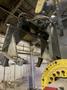 2005 Eagle automated saw and knockout system s/n 05027 with enclosure with light curtain, 2005 Fanuc robot model M-900iA 350 s/n r05743652 with Fanuc system R-J3iB controls s/n e05608535, with saw grips, Eagle enclosure with core knockout system, Allen Bradley plc with panelview 700, core butt discharge conveyor with drive, gate and riser dropoff, related conveyors