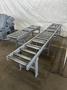 13" X 16" PEERLESS HB1316A HORIZONTAL BAND SAW W/ 10' INFEED AND 20' OUTFEED CONVEYOR. STOCK # 1164323.