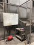 2005 Eagle automated saw and knockout system s/n 05027 with enclosure with light curtain, 2005 Fanuc robot model M-900iA 350 s/n r05743652 with Fanuc system R-J3iB controls s/n e05608535, with saw grips, Eagle enclosure with core knockout system, Allen Bradley plc with panelview 700, core butt discharge conveyor with drive, gate and riser dropoff, related conveyors