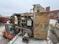 2009 Midan Industries 1000# motorized nose pour furnace with gas system , blower and controls