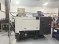 Hwacheon Hi-Tech 200A CNC Lathe, 2009 – Fanuc Oi-TC Control, Mist Buster, Chip Conveyor and Tailstock