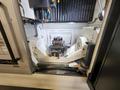 Okuma Genos M460V-5AX 5-Axis CNC VMC, 2021 – Robot Loader, Chip Conveyor, Mist Collector