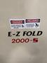 NEDCO E‑Z Fold 2000‑S Automatic Textile Folder – 1,000/hr, Bagging + Heat Seal, OEM Verified