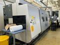 Okuma Macturn 350-W Multi-Axis CNC Lathe, 2004 – Chip Conveyor