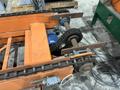 SWEED LOAD CLAMP &amp; TURNER / PACMAN FLIPPER SYSTEM WITH POWERED INFEED &amp; OUTFEED CONVEYORS: STOCK #22075