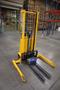 Uline H-2651 Electric Straddle Stacker Lift, 2,200# Cap, 63&quot; Max Height, 50&quot; Between Outriggers, 12 Volt Battery with Charger, 42&quot; Forks- Auction Item