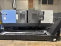 2023 DN SOLUTIONS PUMA 4100LMB CNC Universal Turning Center. Equipped for versatile 2-axis and 3-axis lathing, it features a 15" chuck, 50 HP spindle, and a machining length of 79.8" and with hydraulic open / close steady rest. Perfect for heavy-duty tasks. Fanuc Control, 50HP