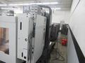 Haas VM-3 5-Axis CNC Vertical Machining Center, Haas TR-210 Trunnion, 40 Station Tool Changer, Probing, 300 PSI TSC, Chip Auger
