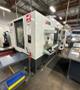 Haas EC-500 Horizontal Machining Center 2014 equipped with Haas CNC Control, CT40 Spindle, 70 Station Automatic Tool Changer, 4th Axis, Probing, Tomb Stones, TSC, Remote Hand Jog, Chip Conveyor, Coolant Pump