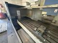 Takumi V32 VMC, 2007 – 4th Axis, CAT50, Box Way, TSC, Chip Conveyor