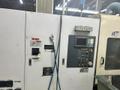 Mitsubishi M-T35E CNC Multi-Spindle Automatic Lathe, 1995 – Chip Conveyor, Bar Feeder