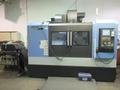 Doosan Mynx 6500/40 CNC Vertical Machining Center with Doosan-Fanuc i Series CNC Control,  30-ATC Thru Spindle Coolant, 12,000 RPM, CAT 40,- Auction Item