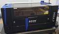 AEON MIRA7 Laser 60w Class 1 CO2 Laser w/Motorized Z Table, Blade Table, 2.0" Focal Lens, Red Dot Beam Combiner, Clean Pack Design, Built-In Air Compressor, Built-In Exhaust Fan, Built-In Water Chiller