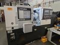Okuma Genos L3000-e CNC Lathe, 2023 – Parts Catcher, Tailstock, Barfeed Interface