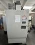 HAAS VM-2 CNC Vertical Machining Center 2011 equipped with quipped with 30"x20"x20" Travels, Haas Control, 4th Axis Drive, 24 ATC Side Mount Tool Changer, Tool Pre-Setter, Cool, Chip Auger