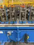 22 STAND X 2" RLM (NEW 2004) ROLLFORMER LINE TOOLED FOR TERMINATOR GUTTER TOPPER, 26" ROLL SPACE STOCK# 4413