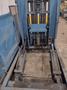 20,000 LBS BRANER HYDRAULIC COIL UPENDER WITH POWER FEED CONVEYOR: YOBRO #25238