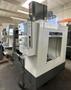 HAAS VM-2 CNC Vertical Machining Center 2011 equipped with quipped with 30"x20"x20" Travels, Haas Control, 4th Axis Drive, 24 ATC Side Mount Tool Changer, Tool Pre-Setter, Cool, Chip Auger