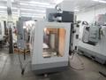 Haas VF-2 CNC Vertical Machining Center with 15,000 RPM CT-40 Spindle, High Speed Machining, Side Mount Tool Changer, 4th Axis Ready, Macros, and Chip Auger.