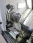 Okuma Genos L250E CNC Turning Center, OSP-P300L/R CNC Control, 8&quot; Chuck, Tool Setter, Parts Catcher, 12-Station Turret, Tailstock, Chip Conveyor