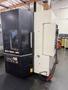 YCM NXV560A-APC VMC, 2015 – Chip Conveyor, Fanuc Control, 12K RPM