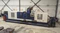 TAKUMI, V32, CNC VERTICAL MACHINING CENTRE, 10,000 RPM SPINDLE, TRAVELS (X,Y,Z): 3200 MM X 1066MM X 750 MM (126&quot; X 42&quot; X 30), DISTANCE FROM NOSE TO SPINDLE:  200MM TO 950MM, DISTANCE FROM SPINDLE NOSE TO THE Z-AXIS GUIDEWAY: 1120MM, T-SLOT TABLE SIZE: 3200MM X 1025MM (126&quot; X 40&quot;), MAX TABLE LOAD, 4500 KG (9,920 LBS), 32 TOOL ATC, TABLE SIZE: 42&quot; X 130&quot;, CAT 50, 30 KW, SPINDLE FLOOD AND THROUGH COOLANT, AIR BLAST, COOLANT FILTER SYSTEM, CHIP WASH DOWN SYSTEM, CHILLED BALL SCREW AND SPINDLE, 4-AXIS CAPABLE,  LEFT AND RIGHT CHIP CONVEYOR,  MITSUBISHI, MEDLAS 60S, CNC CONTROL, 2006, 220/3/60 50 AMP, MACHINE WEIGHT:  52.500 LBS. FLOOR SPACE (W, L, H) 295&quot; X 173&quot; X 139.7&quot; (APPROX.), S/N K0133