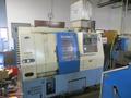 Kia Super KiaTurn 15 CNC Turning Center with Yasnac J50L CNC Control, 6&quot; 3-Jaw Chuck, Tool Setter, 12-Tools, Tailstock, Chip Conveyor and MORE!- Auction Item