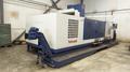 TAKUMI, V32, CNC VERTICAL MACHINING CENTRE, 10,000 RPM SPINDLE, TRAVELS (X,Y,Z): 3200 MM X 1066MM X 750 MM (126&quot; X 42&quot; X 30), DISTANCE FROM NOSE TO SPINDLE:  200MM TO 950MM, DISTANCE FROM SPINDLE NOSE TO THE Z-AXIS GUIDEWAY: 1120MM, T-SLOT TABLE SIZE: 3200MM X 1025MM (126&quot; X 40&quot;), MAX TABLE LOAD, 4500 KG (9,920 LBS), 32 TOOL ATC, TABLE SIZE: 42&quot; X 130&quot;, CAT 50, 30 KW, SPINDLE FLOOD AND THROUGH COOLANT, AIR BLAST, COOLANT FILTER SYSTEM, CHIP WASH DOWN SYSTEM, CHILLED BALL SCREW AND SPINDLE, 4-AXIS CAPABLE,  LEFT AND RIGHT CHIP CONVEYOR,  MITSUBISHI, MEDLAS 60S, CNC CONTROL, 2006, 220/3/60 50 AMP, MACHINE WEIGHT:  52.500 LBS. FLOOR SPACE (W, L, H) 295&quot; X 173&quot; X 139.7&quot; (APPROX.), S/N K0133