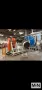 2 ARM ROTOLINE MODEL DC3.00XT ROTATIONAL MOLDING MACHINE MFG 2000