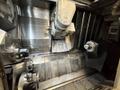 Okuma Macturn 350-W Multi-Axis CNC Lathe, 2004 – Chip Conveyor