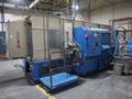 Parker Ionics GX7000M Automated Powder Coating Booth with 24" Wide x 48" High Windows and Top Chain Slot- Auction Item