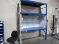 Pallet Rack Shipping Desk Unit, Tab and Slot Style, (2) Uprights 120" x 36", (3) 7' Shelves, with Added Shelving and Overhead Light- Auction Item