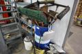 Drum of Cleaning Tools, Brooms, Squeegees, Dust Pans, Bucket Vac- Auction Item