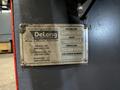 2012 DeLong 7 super model DSTB7 rubber belt tumblast machine s/n 0066281 rated at 7 cu ft capacity, 20hp direct drive shot wheel, offered rebuilt