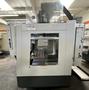 HAAS VM-2 CNC Vertical Machining Center 2011 equipped with quipped with 30"x20"x20" Travels, Haas Control, 4th Axis Drive, 24 ATC Side Mount Tool Changer, Tool Pre-Setter, Cool, Chip Auger