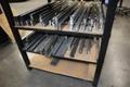 Press Brake Dies and Lower Die Holders for Amada Press Brakes on Welded Steel Shelving- Auction Item