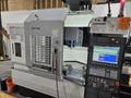 Okuma Genos M560-V CNC VMC, 2022 – Low Hours, TSC, Probes, 4th Axis, Chip Conveyor, 15K Spindle
