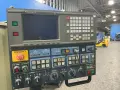 MAKINO MILLING MACHINE CO., LTD. 18”X32” TABLE CNC VERTICAL MACHINING CENTER  -  SNC64-A5