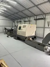 Hardinge Conquest T42 CNC Turret Lathe, 1997 – Live tooling, Chip Conveyor, LNS Bar Feeder