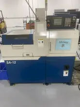 Nexturn SA-12 CNC Swiss Lathe, 2002 – BWG Bar Loader, Fanuc Control