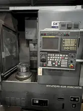 HYUNDAI KIA 31.5" CNC VTL WITH LIVE TOOLING AND 15" 3 JAW CHUCK, FANUC 21iT CONTROL, MODEL SKT-V5RM, NEW 2009
