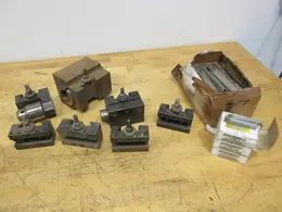 Aloris, Dorian, and Other CXA Quick Change Tool Post Holders, with 3 Boxes (12ea) 3/8 Carbide Tipped Stick Tools, Box of HSS Cutoff Blades- Auction Item