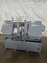 13" X 16" PEERLESS HB1316A HORIZONTAL BAND SAW W/ 10' INFEED AND 20' OUTFEED CONVEYOR. STOCK # 1164323.