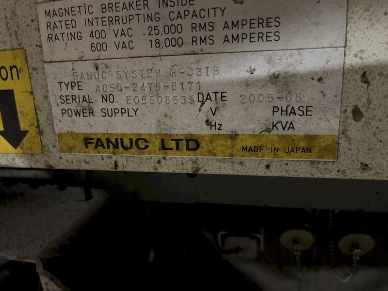 2005 Eagle automated saw and knockout system s/n 05027 with enclosure with light curtain, 2005 Fanuc robot model M-900iA 350 s/n r05743652 with Fanuc system R-J3iB controls s/n e05608535, with saw grips, Eagle enclosure with core knockout system, Allen Bradley plc with panelview 700, core butt discharge conveyor with drive, gate and riser dropoff, related conveyors