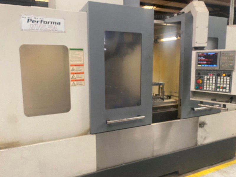 Akira Seiki Performa HV5.5A VMC, 2015 – Chip Conveyor, Mi645 Control